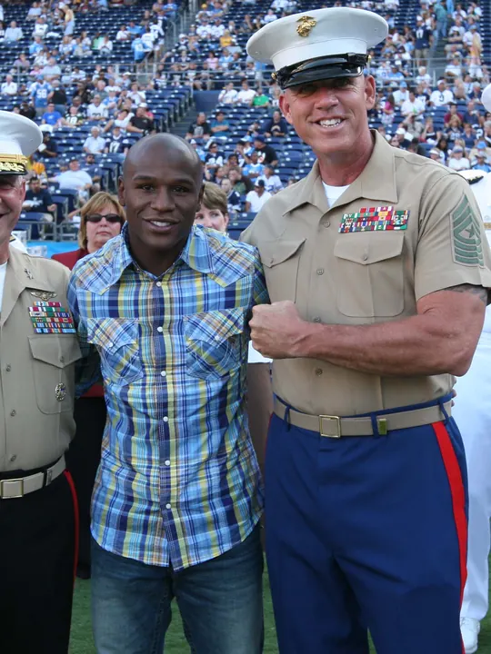 Floyd Mayweather Jr. with U.S. Marine Corps leaders at a stadium